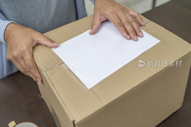 Woman getting the shipment delivered to home from online shopping